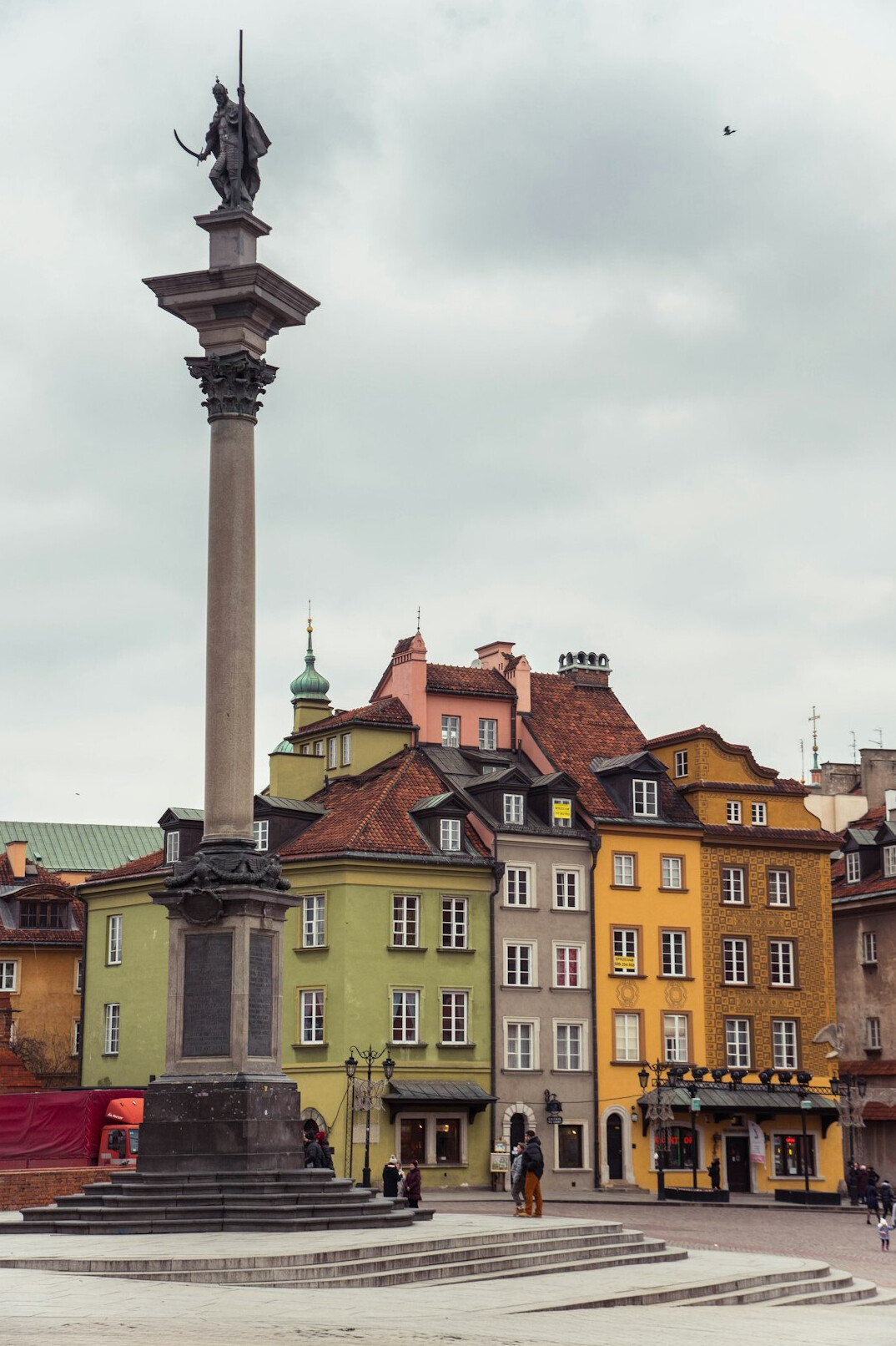 Historic city square with clock tower in Poland